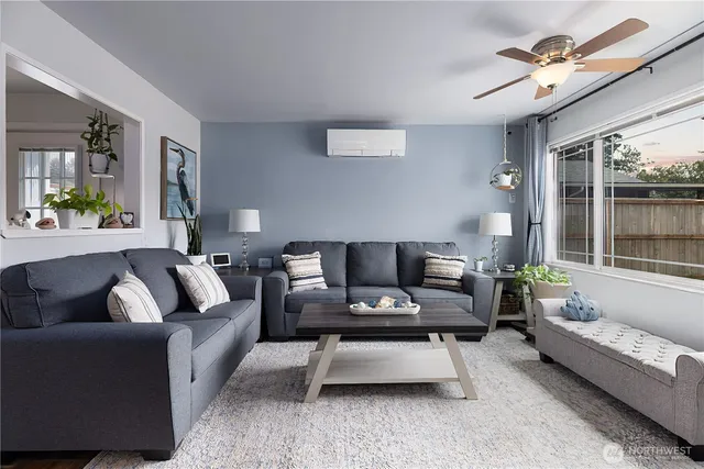 a living room with furniture and a large window