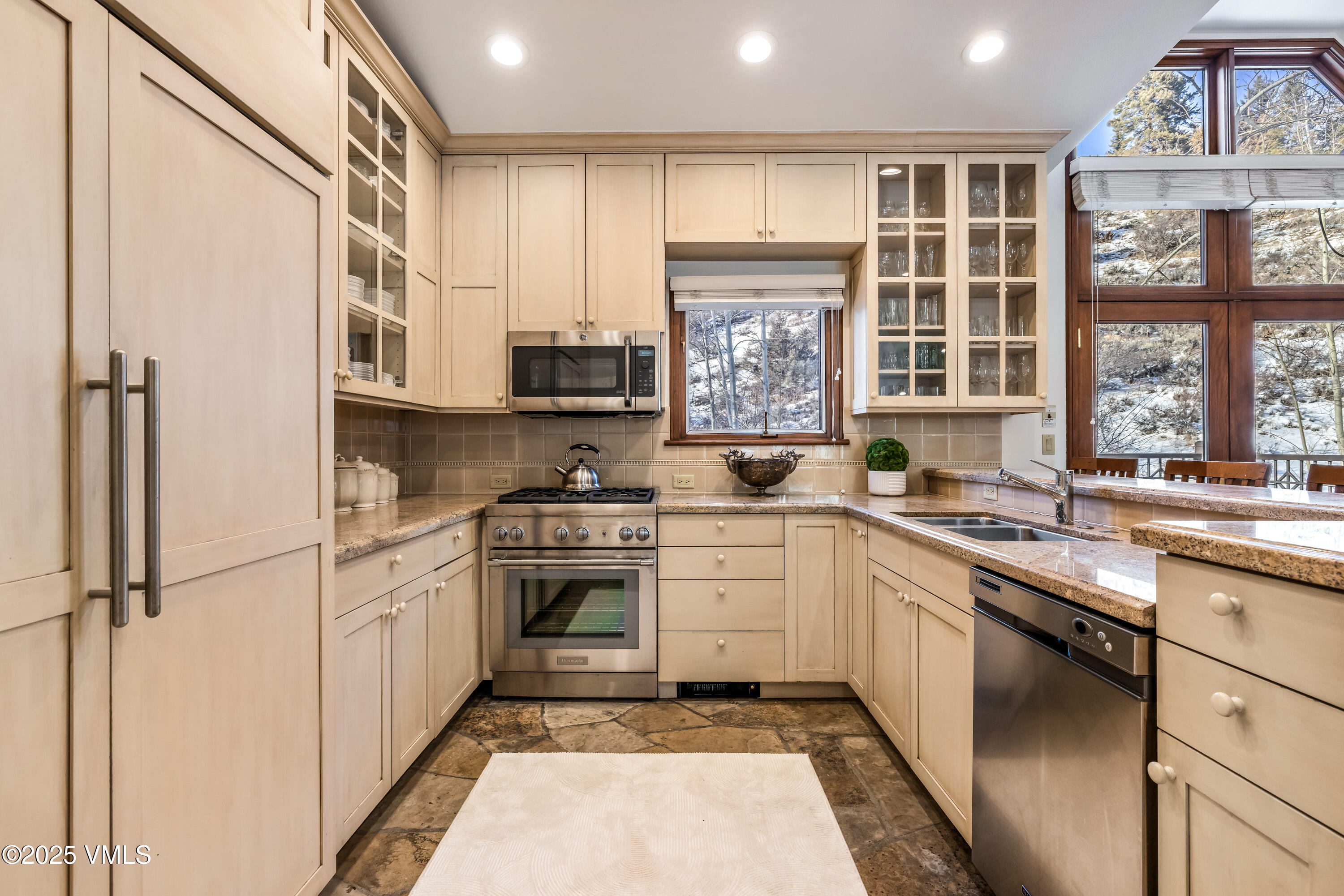 355 Offerson Road, Unit P4 Beaver Creek, CO 81620 - Photo 11 of 43 a kitchen with stainless steel appliances granite countertop a stove a sink and a refrigerator
