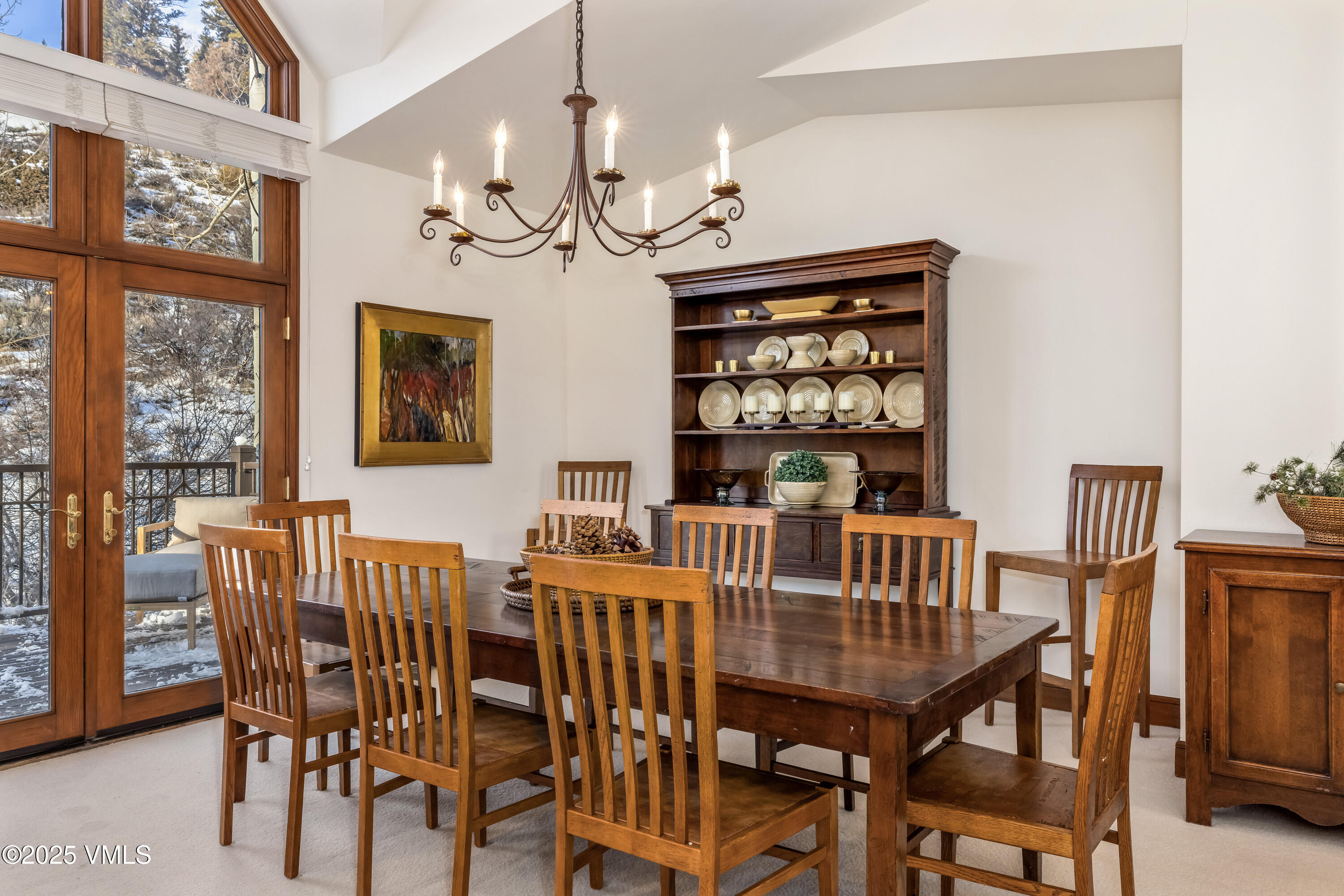 355 Offerson Road, Unit P4 Beaver Creek, CO 81620 - Photo 14 of 43 a view of a dining room with furniture wooden floor and chandelier