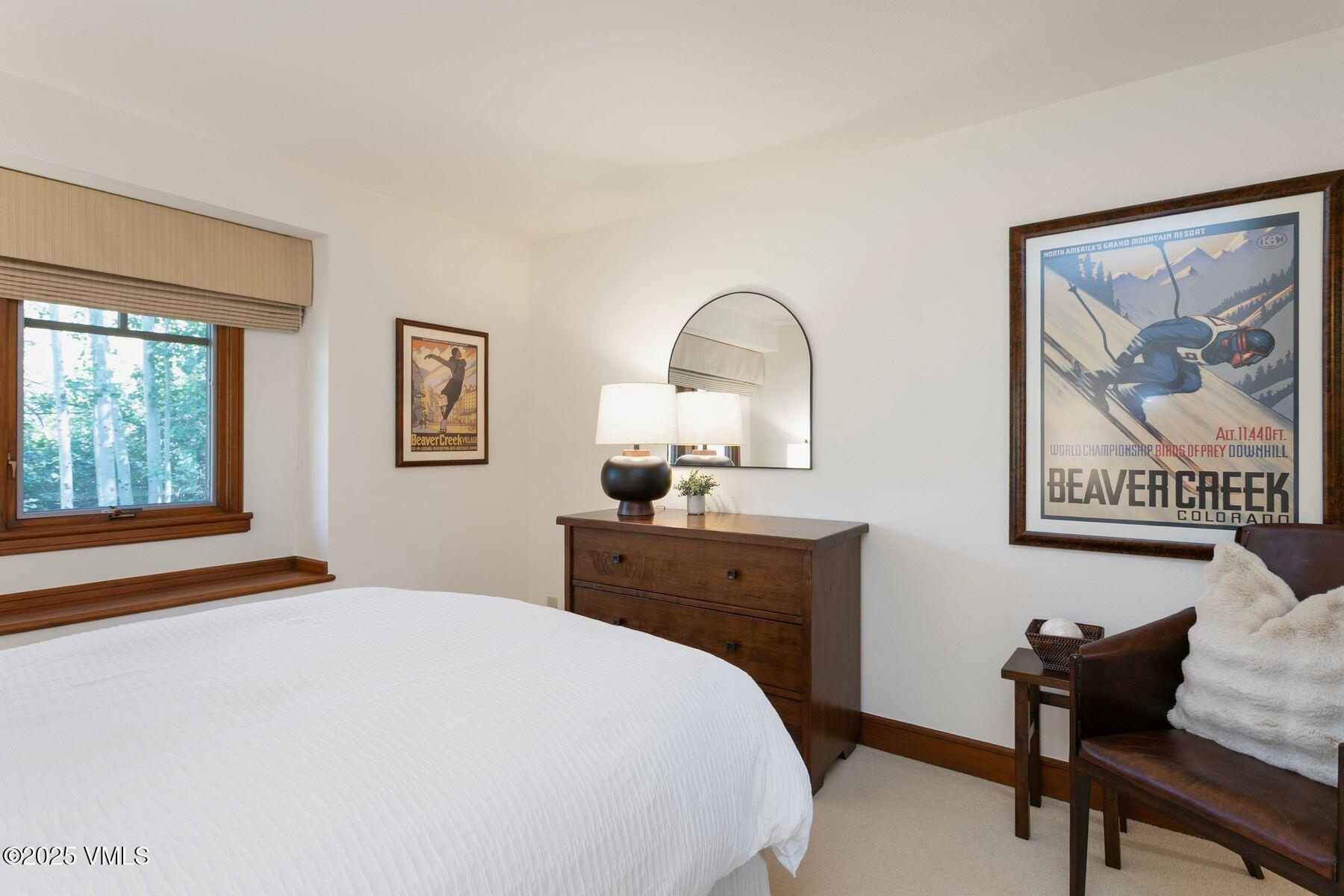 355 Offerson Road, Unit P4 Beaver Creek, CO 81620 - Photo 22 of 43 a bedroom with a bed and a table