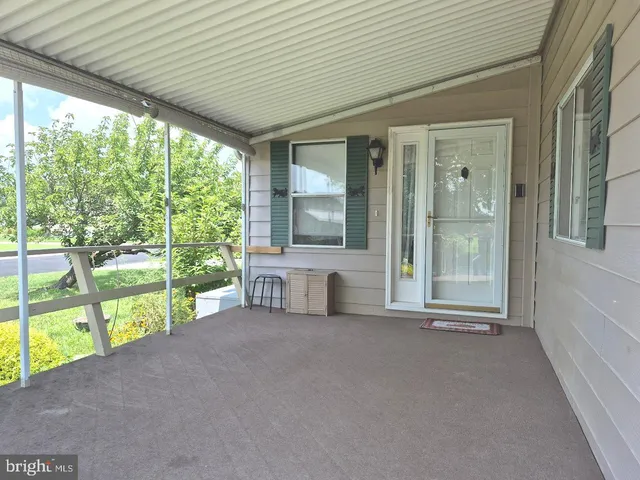 a view of an empty room with a large window