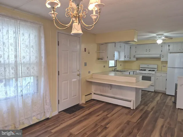 a view of kitchen and sink