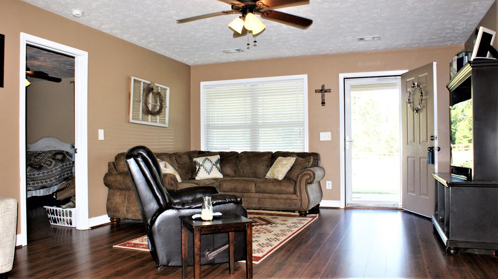 398 Owens Road Fort Mitchell, AL 36856 - Photo 14 of 17 a living room with furniture a flat screen tv and wooden floor