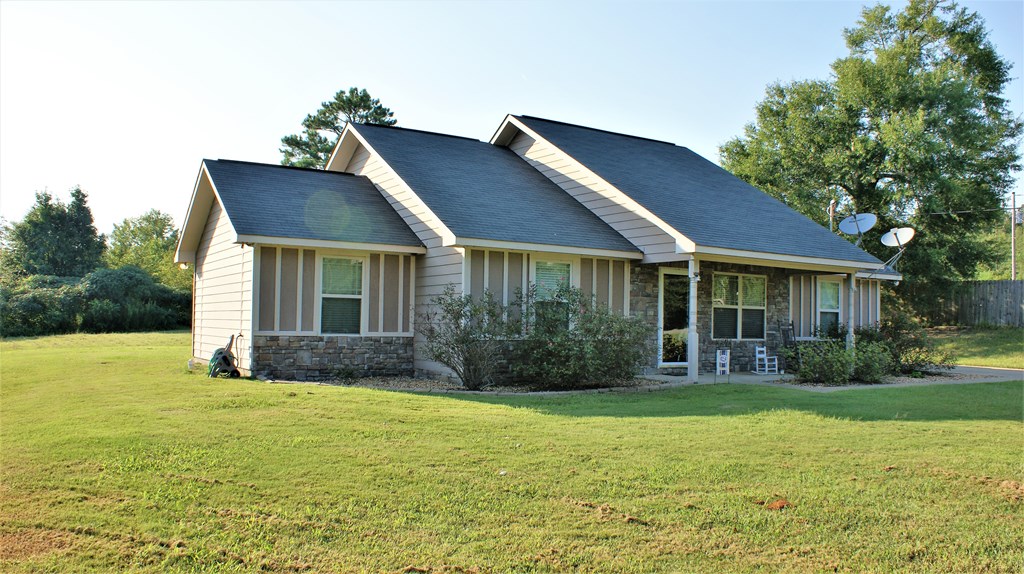 398 Owens Road Fort Mitchell, AL 36856 - Photo 2 of 17 a front view of a house with garden