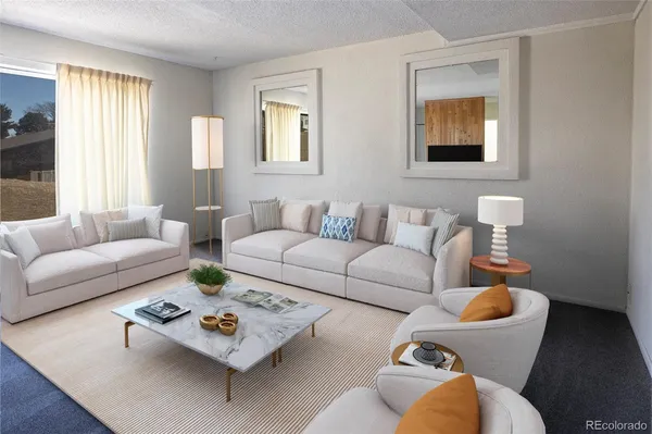 a living room with furniture and a table