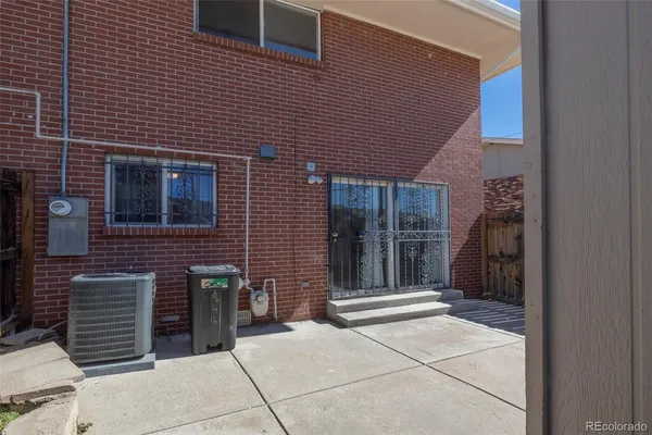 a backyard of a house with barbeque oven