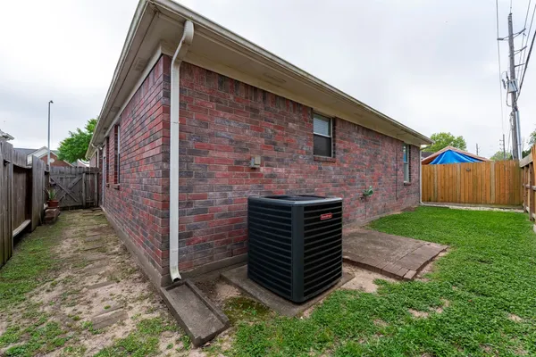 a view of house with backyard