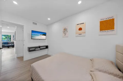 a room with a bed and a window