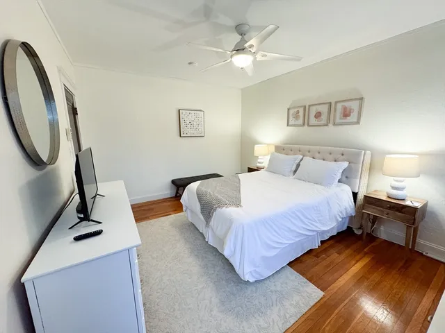 a bedroom with a bed furniture and a window