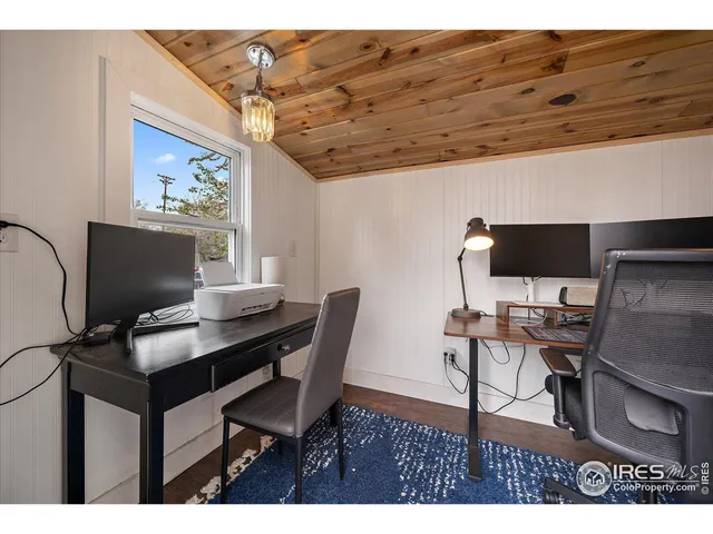 a view of a workspace with furniture