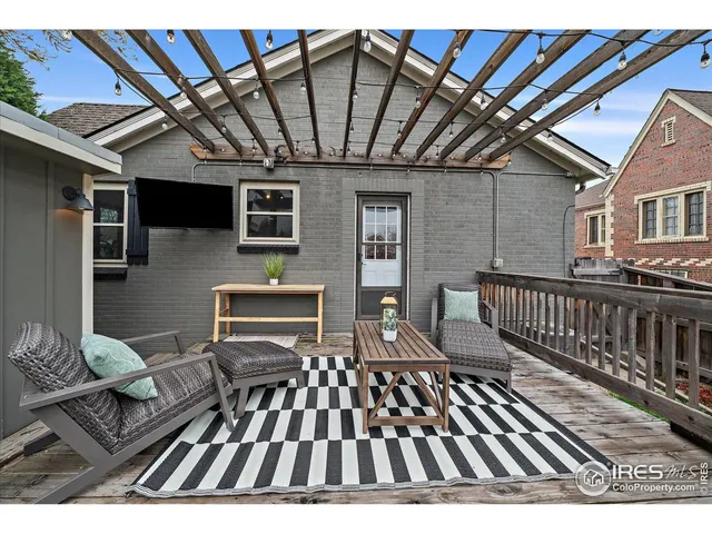 a view of a balcony with furniture