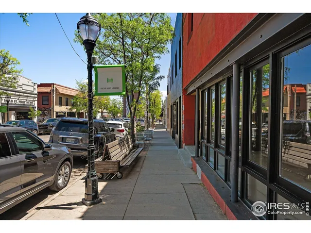 a view of a chairs and tables in the balcony