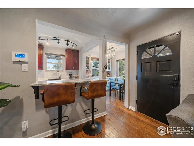 a view of kitchen with cabinets and wooden floor