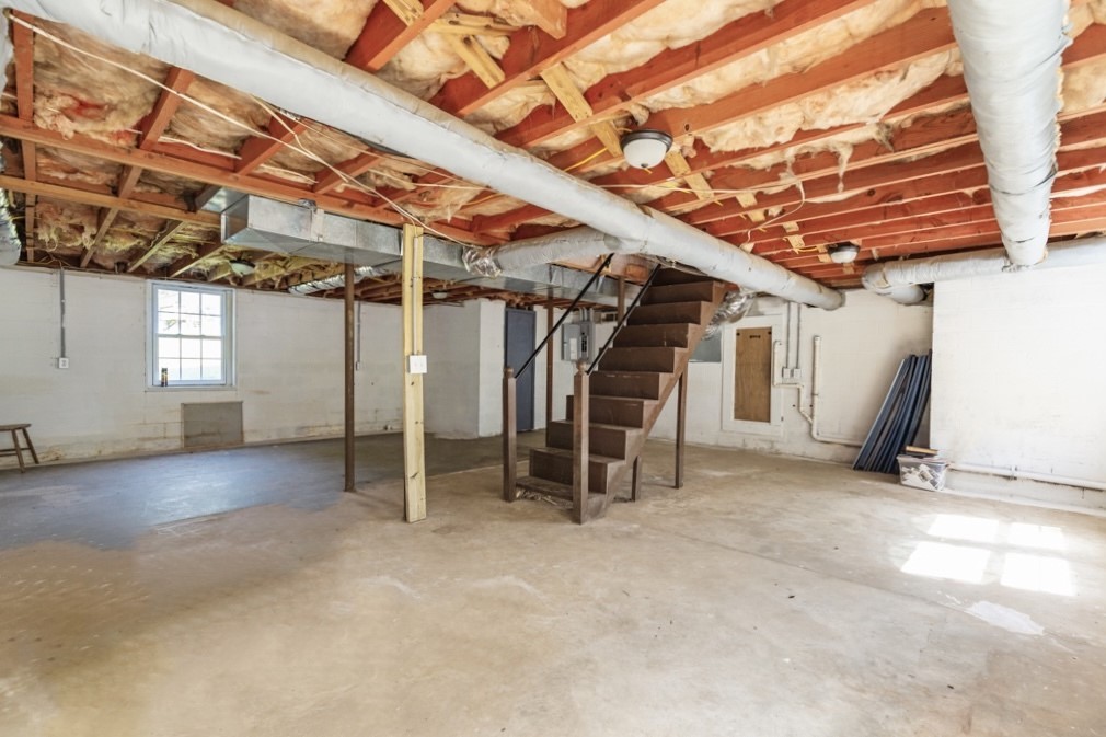 104 Doyle Drive Seneca, SC 29678 - Photo 14 of 19 This spacious basement offers a solid foundation for future development and versatile usage.