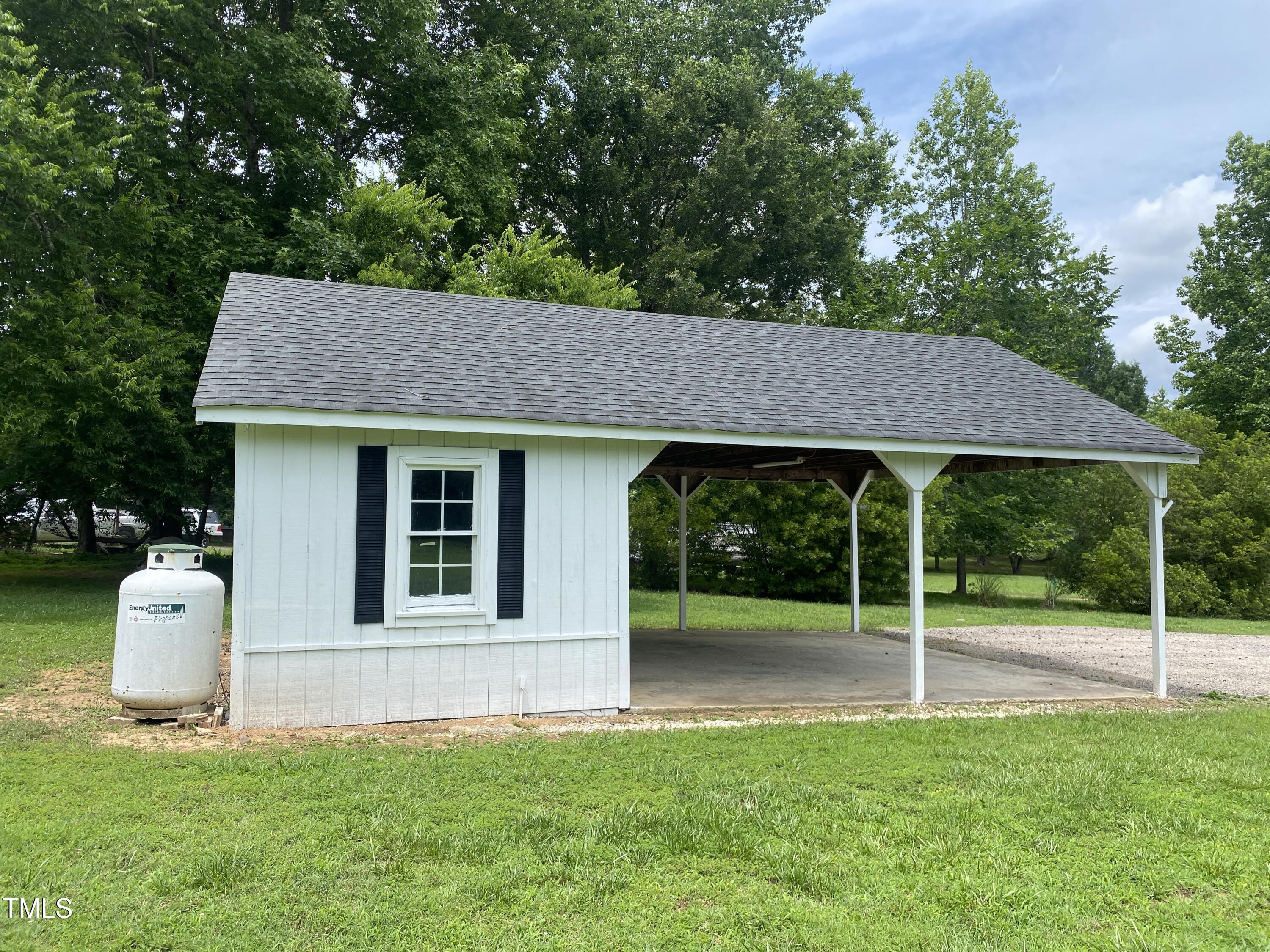2020 Sanders Road Stem, NC 27581 - Photo 21 of 23 a view of a house with backyard