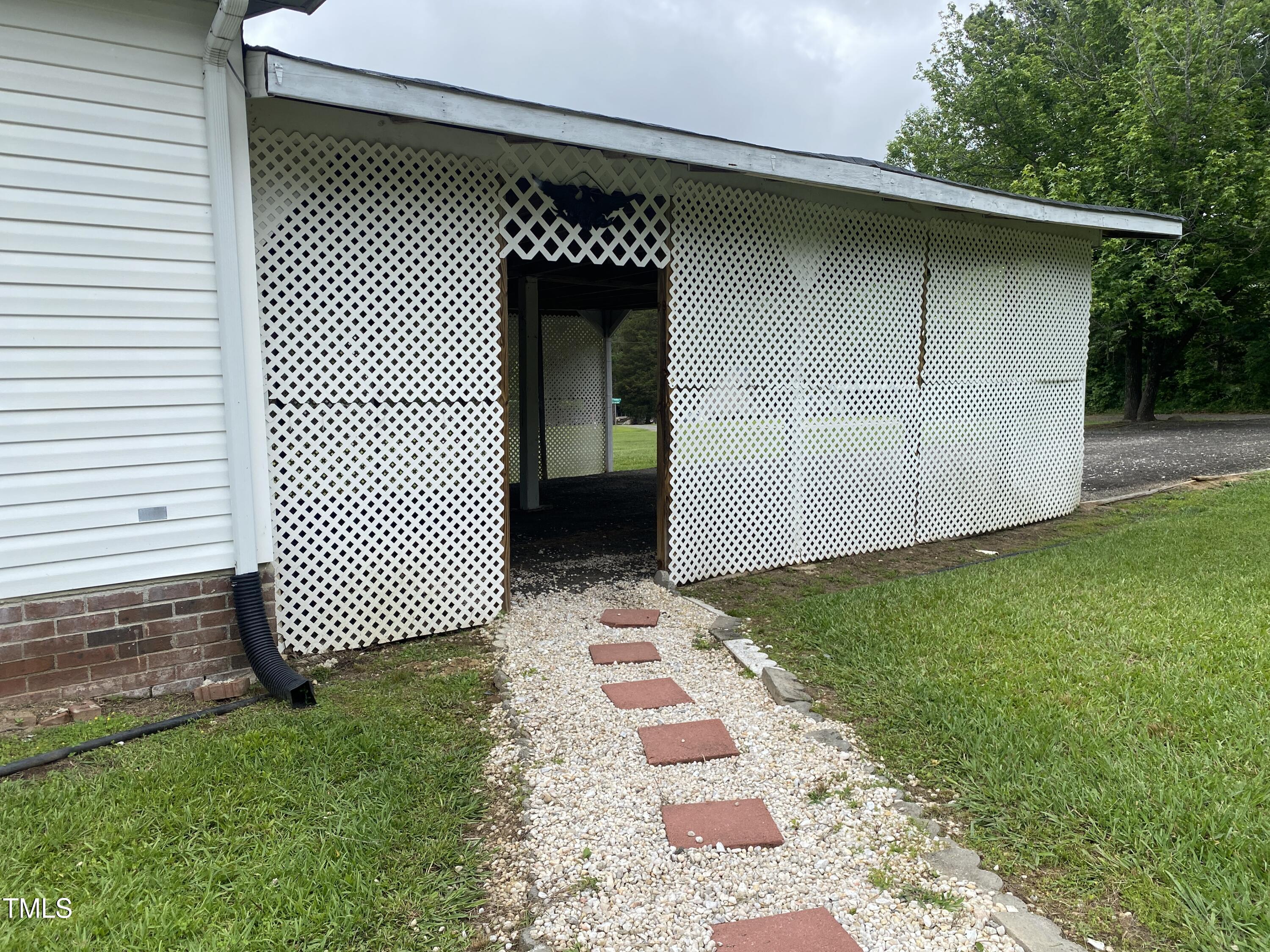 2020 Sanders Road Stem, NC 27581 - Photo 23 of 23 a backyard of a house with lots of green space