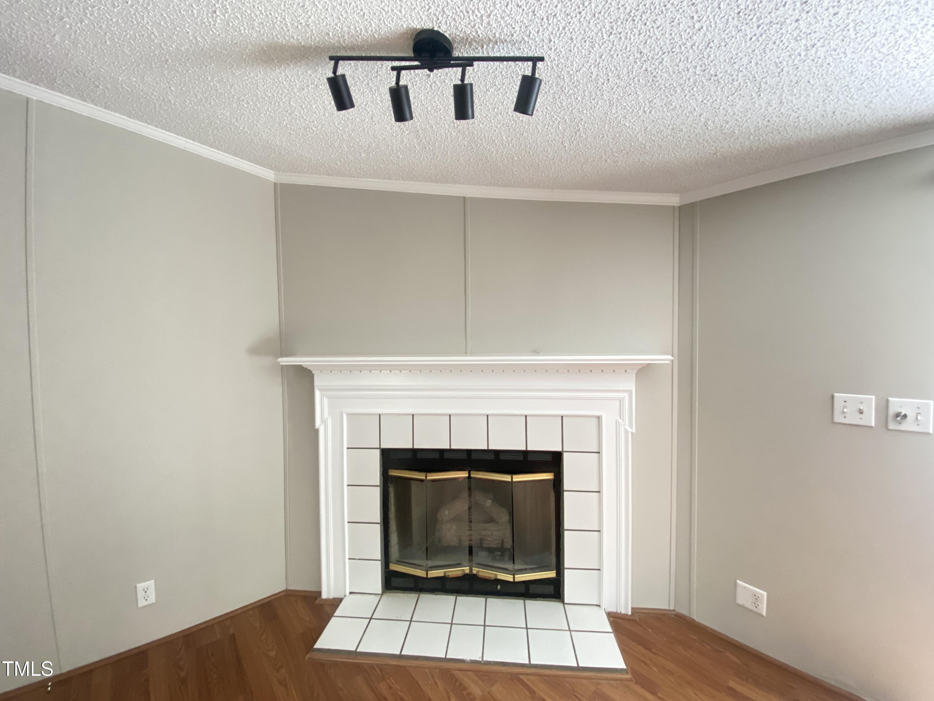 2020 Sanders Road Stem, NC 27581 - Photo 3 of 23 a living room with a fireplace