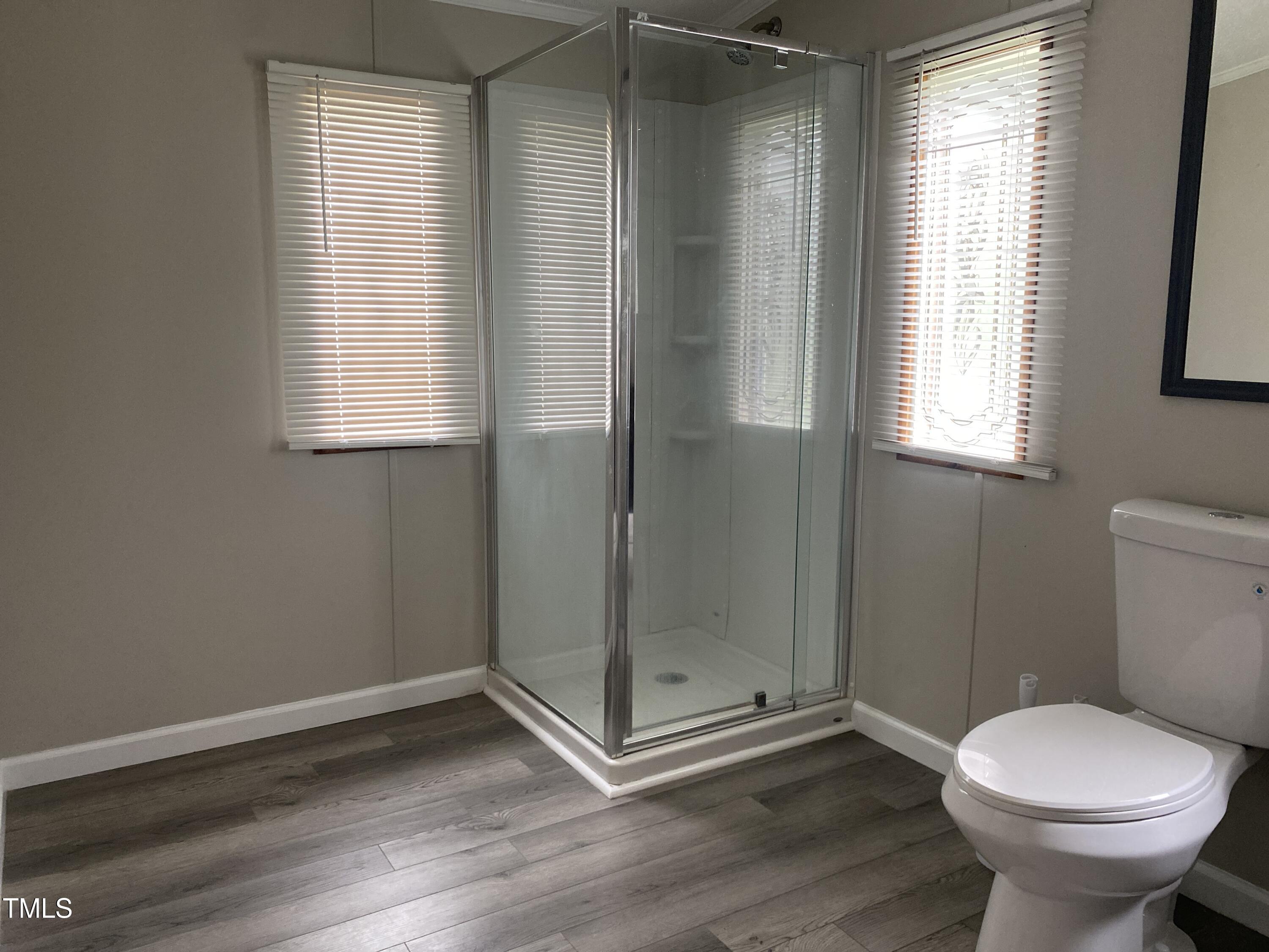 2020 Sanders Road Stem, NC 27581 - Photo 8 of 23 a bathroom with a toilet and a shower