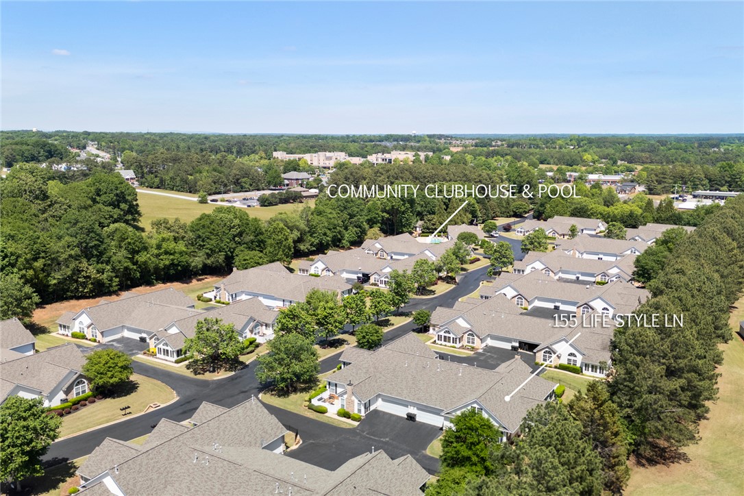 155 Life Style Lane Anderson, SC 29621 - Photo 46 of 49 An aerial perspective showcases a residential community with lush green spaces and a vibrant neighborhood.