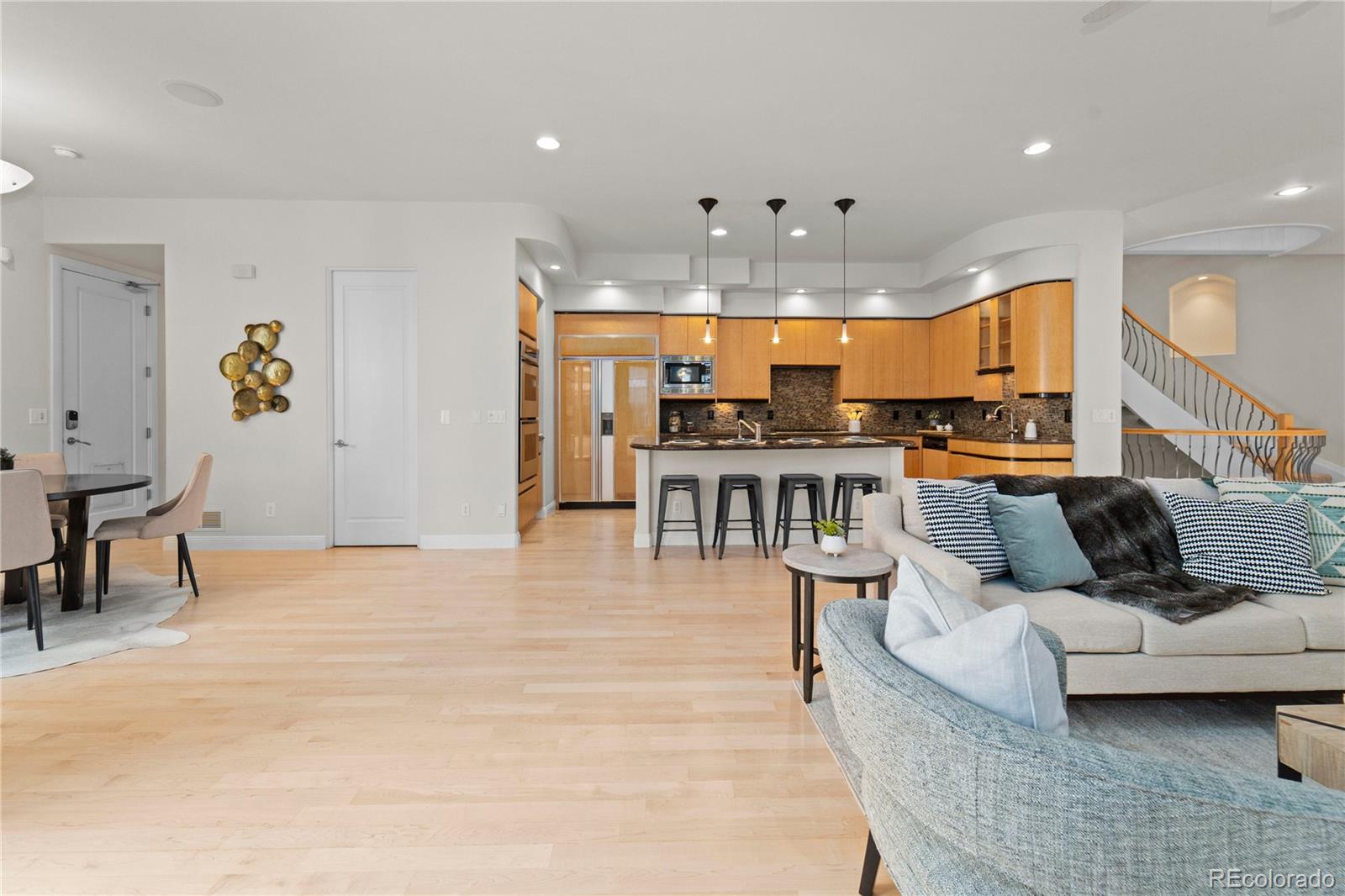 465 Madison Street Denver, CO 80206 - Photo 14 of 40 a living room with furniture and kitchen view