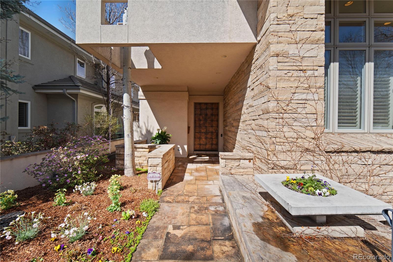 465 Madison Street Denver, CO 80206 - Photo 2 of 40 a front view of a house with a yard