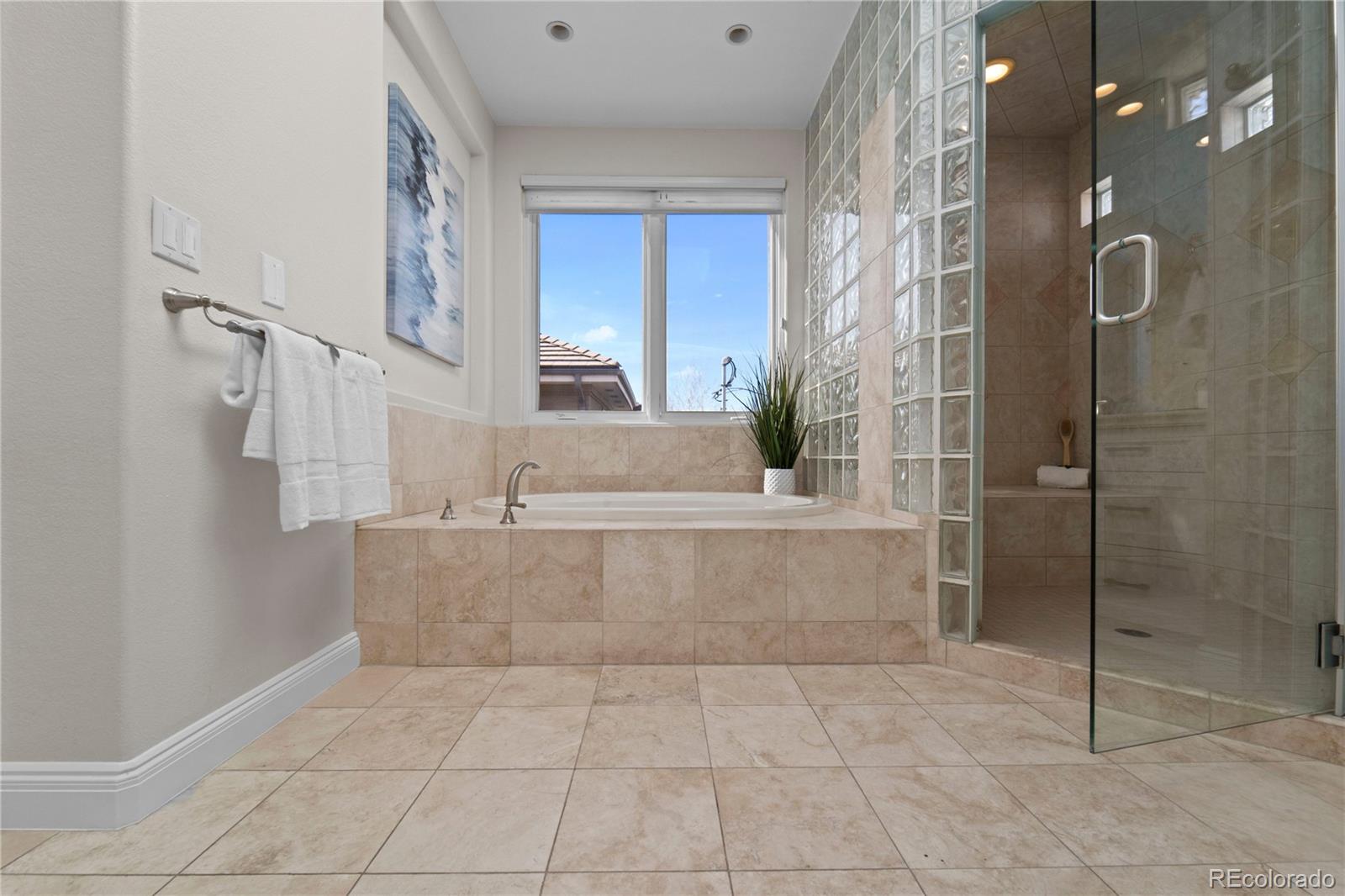 465 Madison Street Denver, CO 80206 - Photo 25 of 40 a bathroom with a bathtub and shower