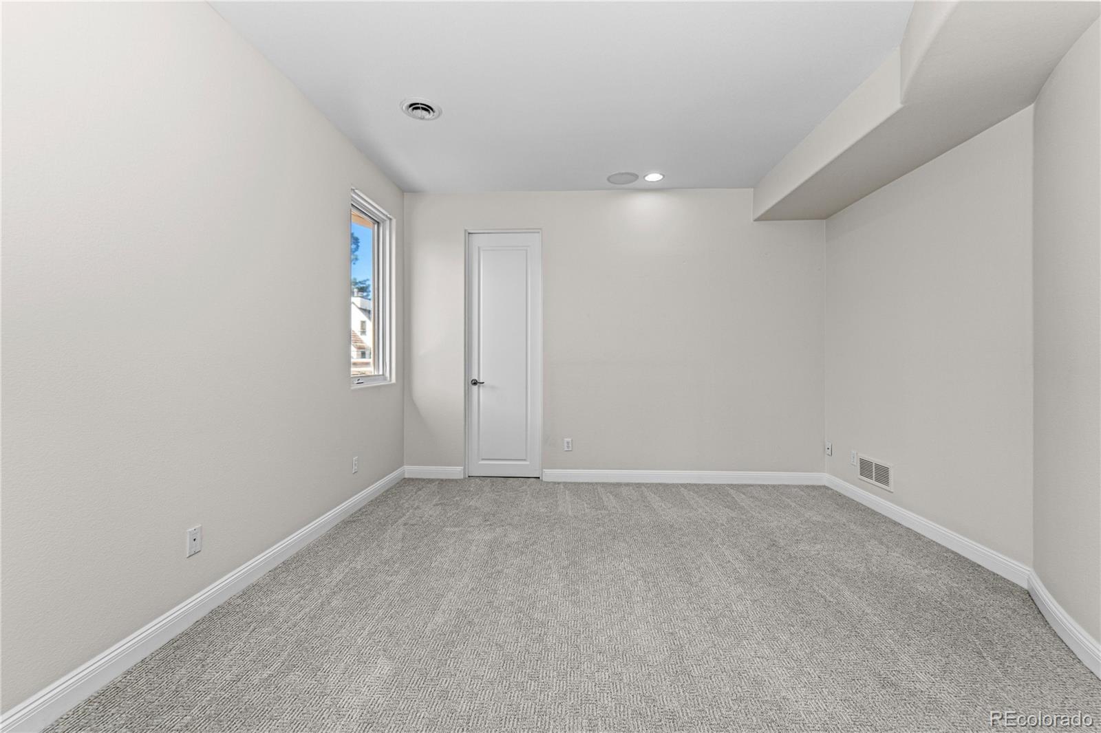 465 Madison Street Denver, CO 80206 - Photo 30 of 40 a view of an empty room with a window