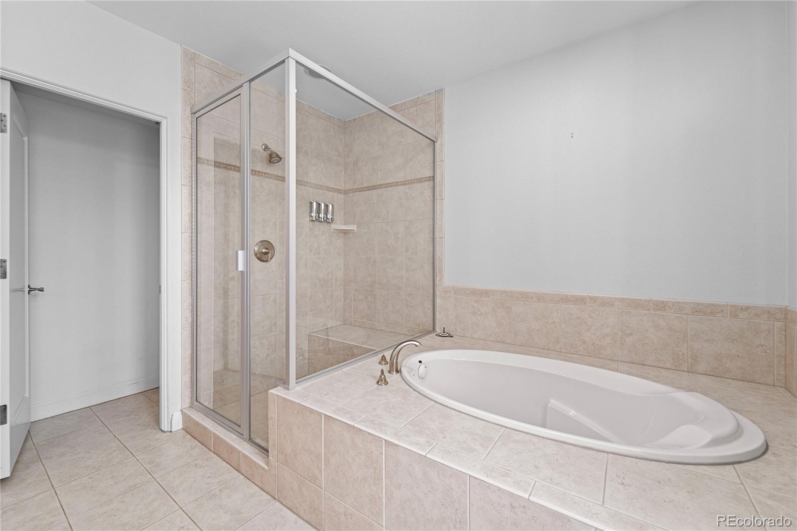 465 Madison Street Denver, CO 80206 - Photo 32 of 40 a bathroom with a tub and shower