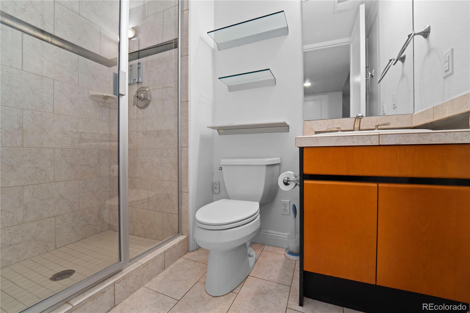 465 Madison Street Denver, CO 80206 - Photo 36 of 40 a bathroom with a toilet sink and shower