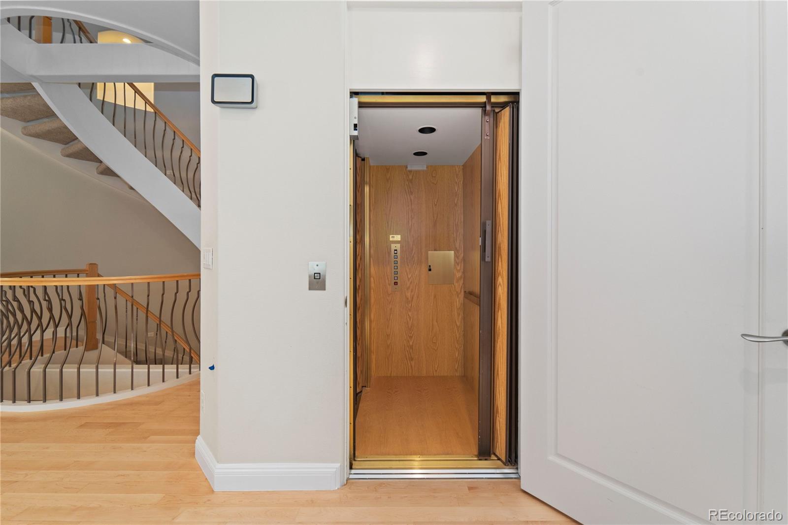 465 Madison Street Denver, CO 80206 - Photo 6 of 40 a view of a hallway with wooden floor