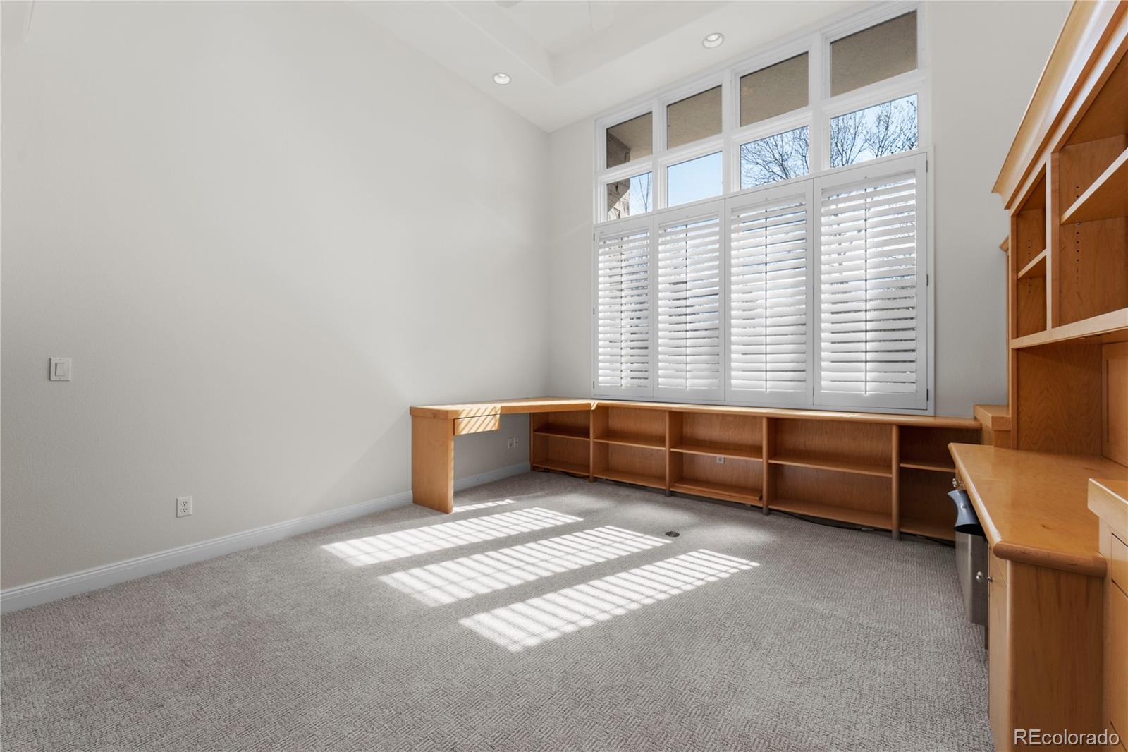 465 Madison Street Denver, CO 80206 - Photo 8 of 40 a bedroom with furniture and a window