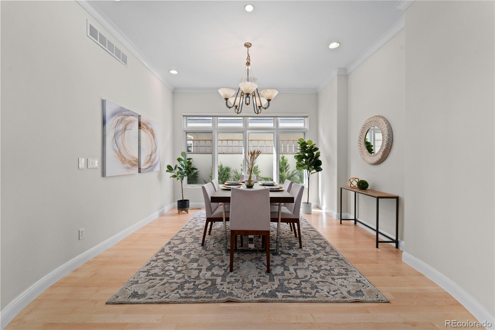 465 Madison Street Denver, CO 80206 - Photo 9 of 40 a view of a dining room with furniture window and wooden floor