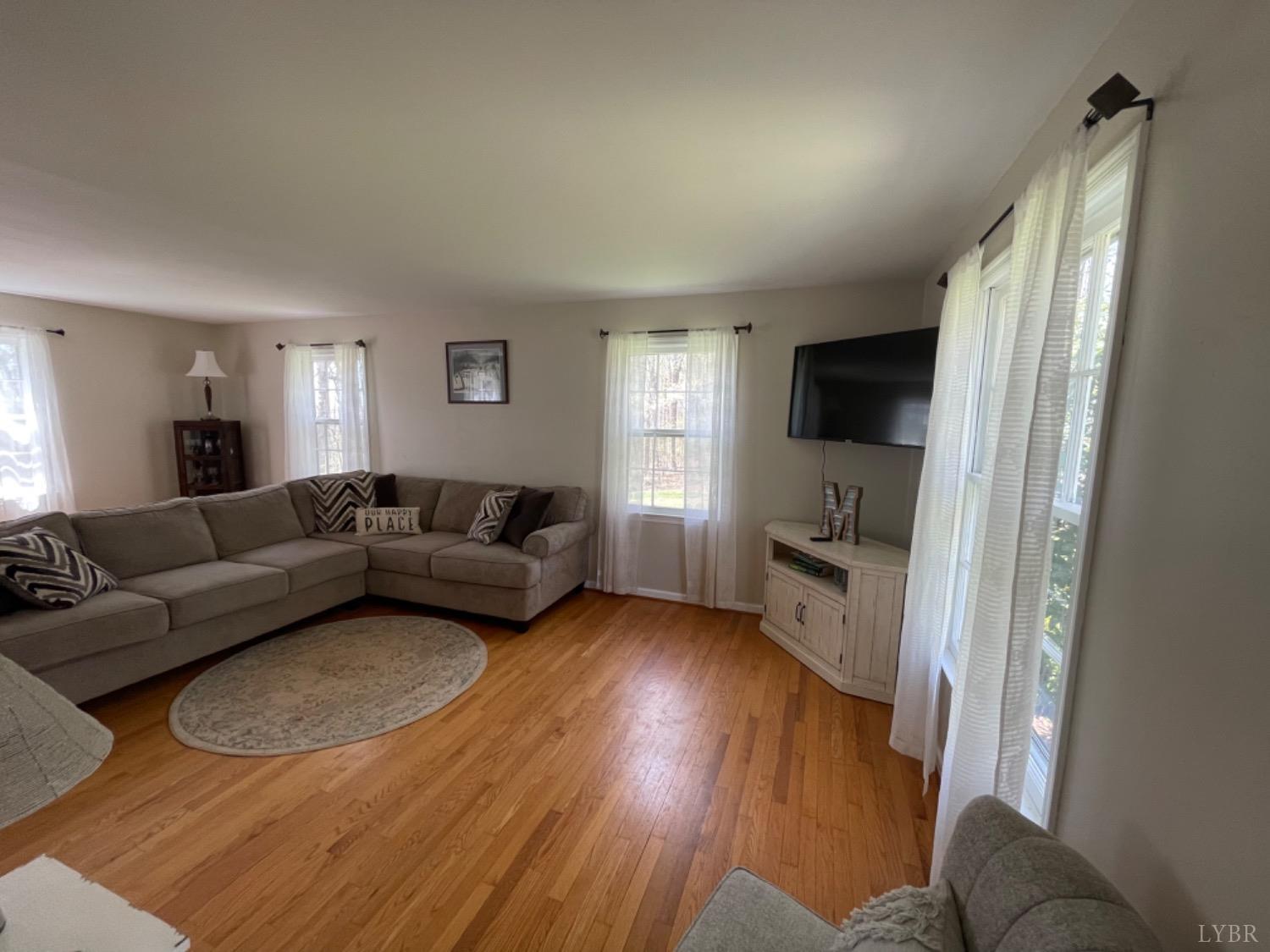 2355 Country Club Road Appomattox, VA 24522 - Photo 16 of 41 a living room with furniture and a flat screen tv