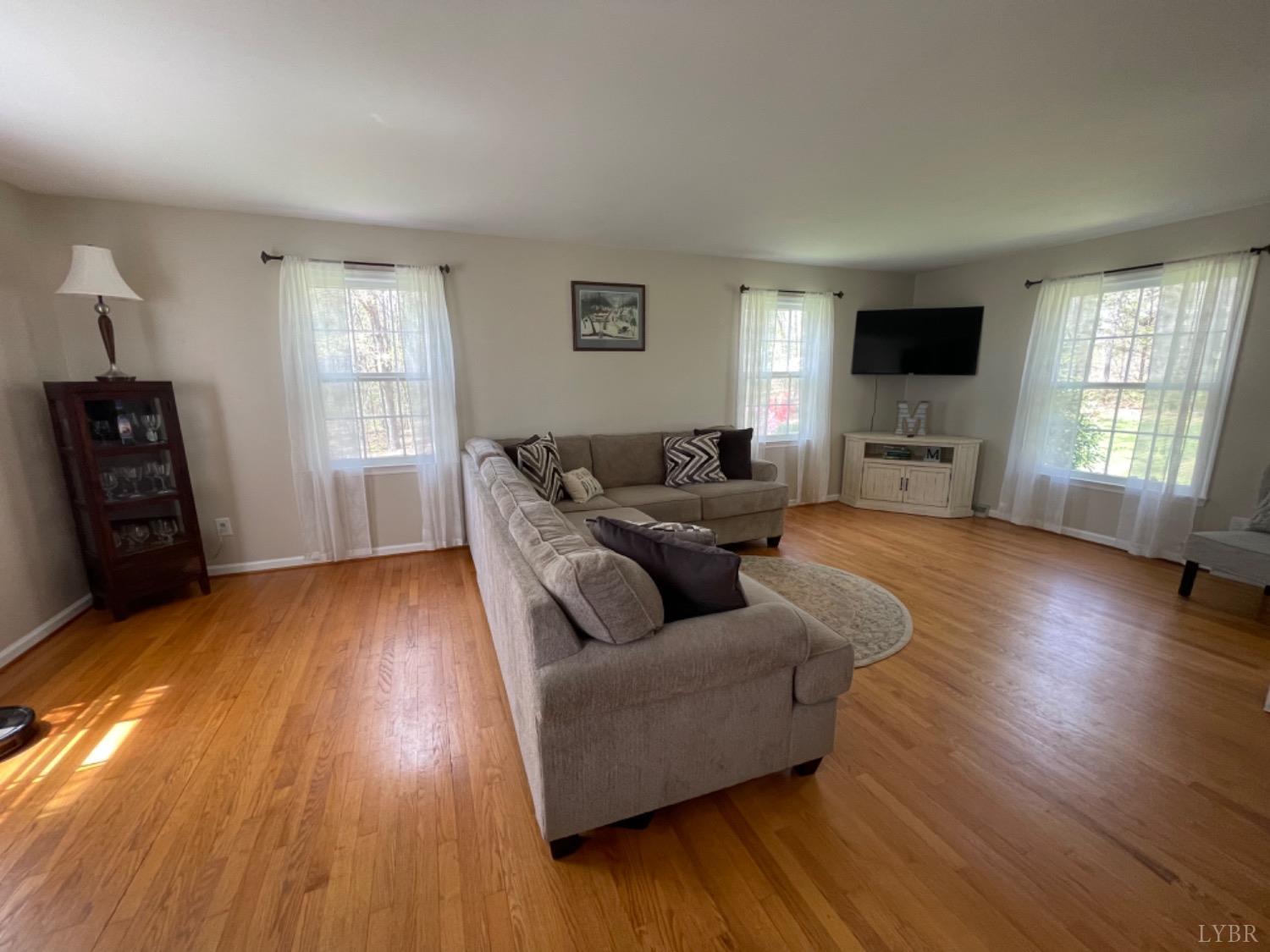 2355 Country Club Road Appomattox, VA 24522 - Photo 20 of 41 a living room with furniture and a flat screen tv