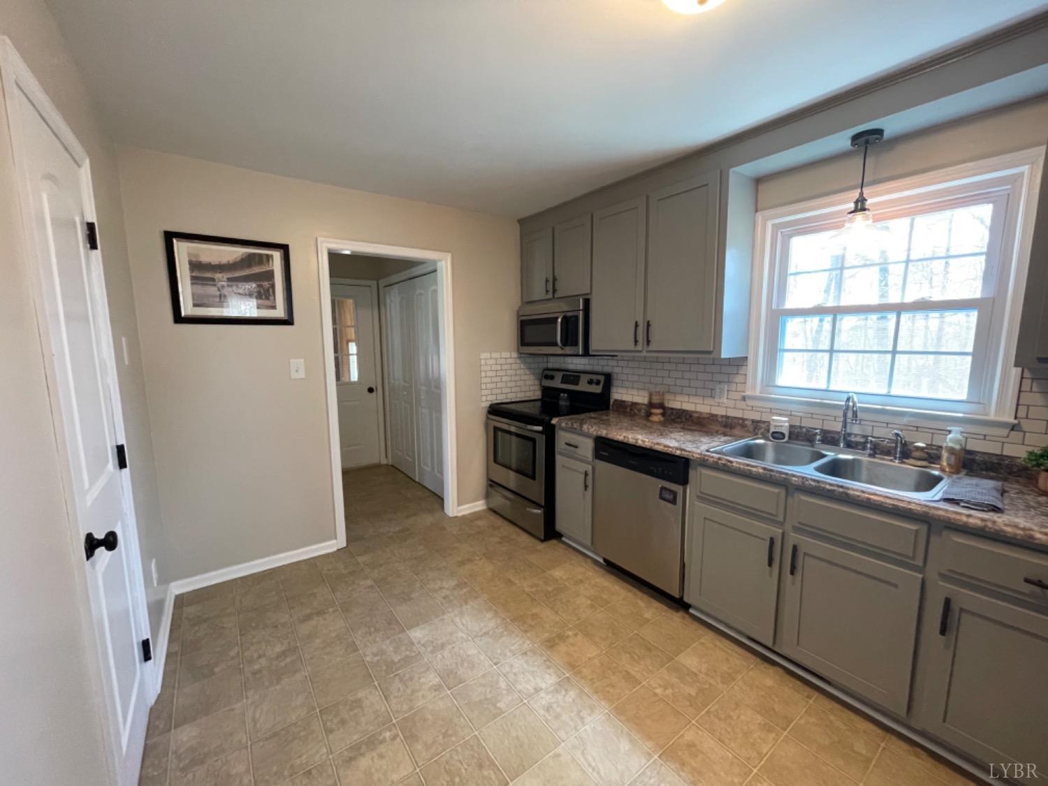 2355 Country Club Road Appomattox, VA 24522 - Photo 21 of 41 a kitchen with sink cabinets and window