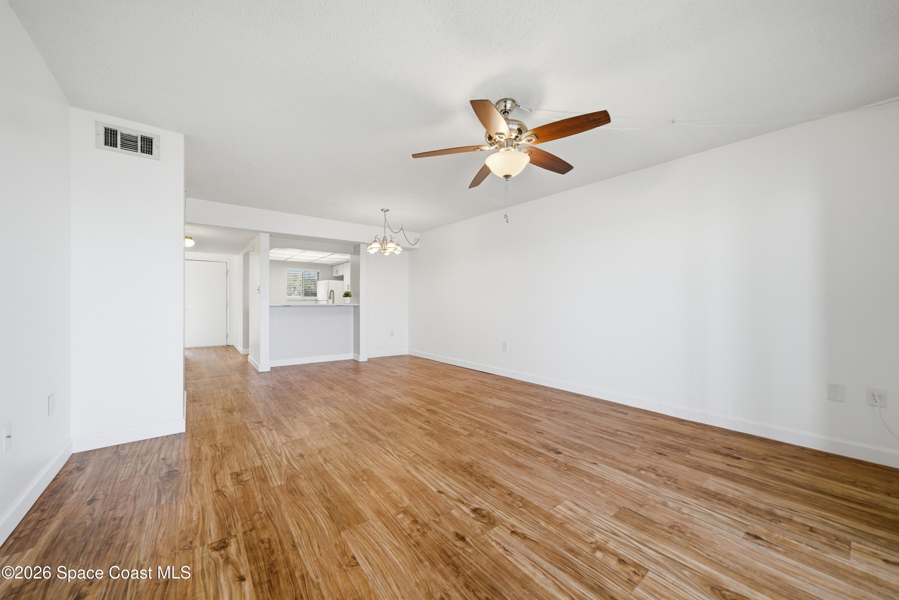 6850 Highway 1, Unit 5204 Grant, FL 32949 - Photo 11 of 33 a view of empty room with wooden floor and fan