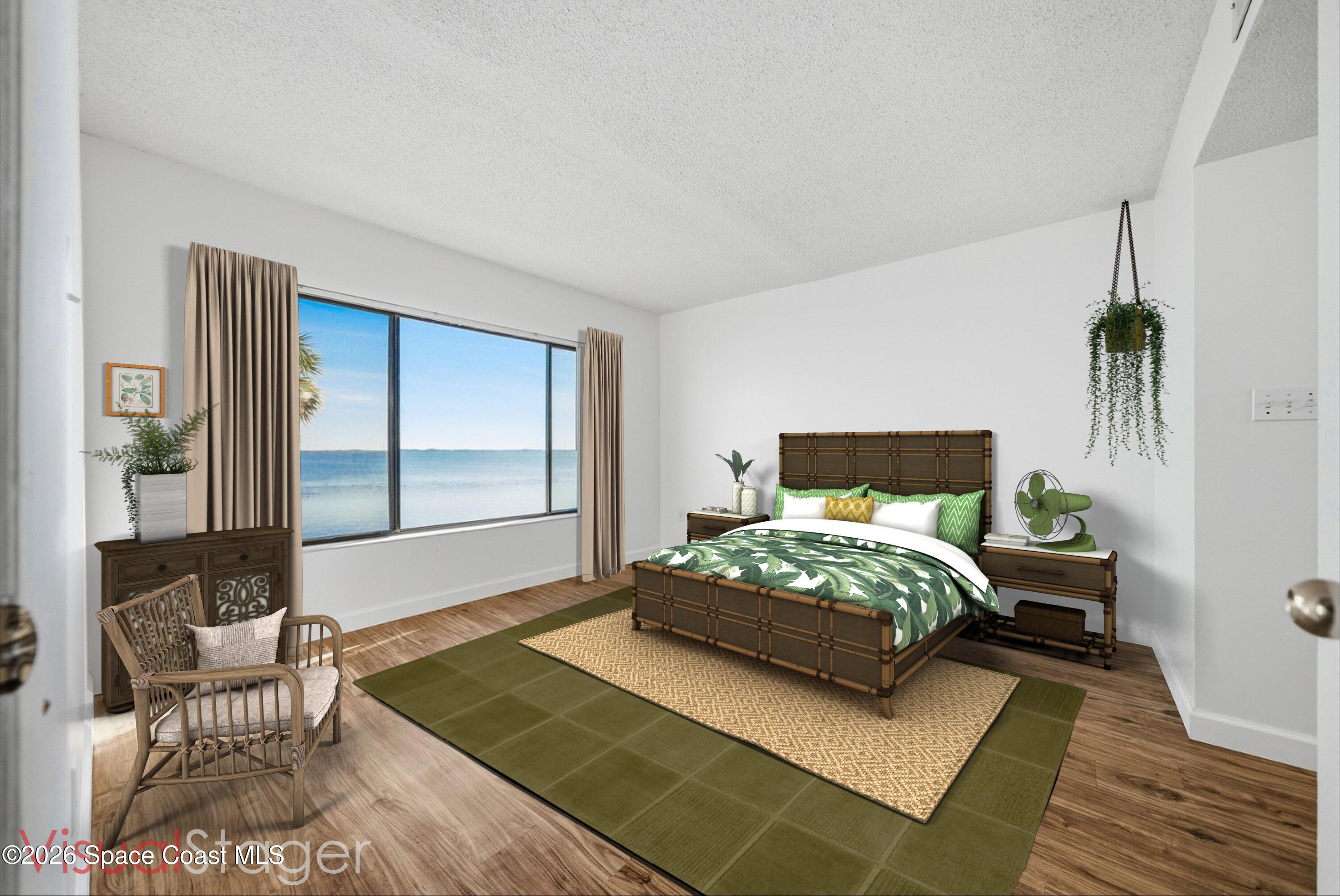 6850 Highway 1, Unit 5204 Grant, FL 32949 - Photo 14 of 33 a bedroom with a bed and wooden floor