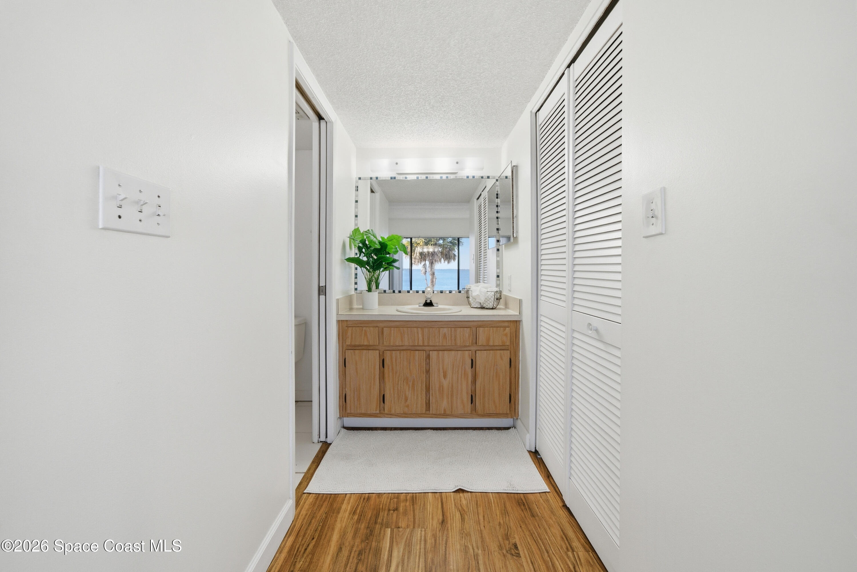 6850 Highway 1, Unit 5204 Grant, FL 32949 - Photo 16 of 33 a bathroom with a sink and a mirror
