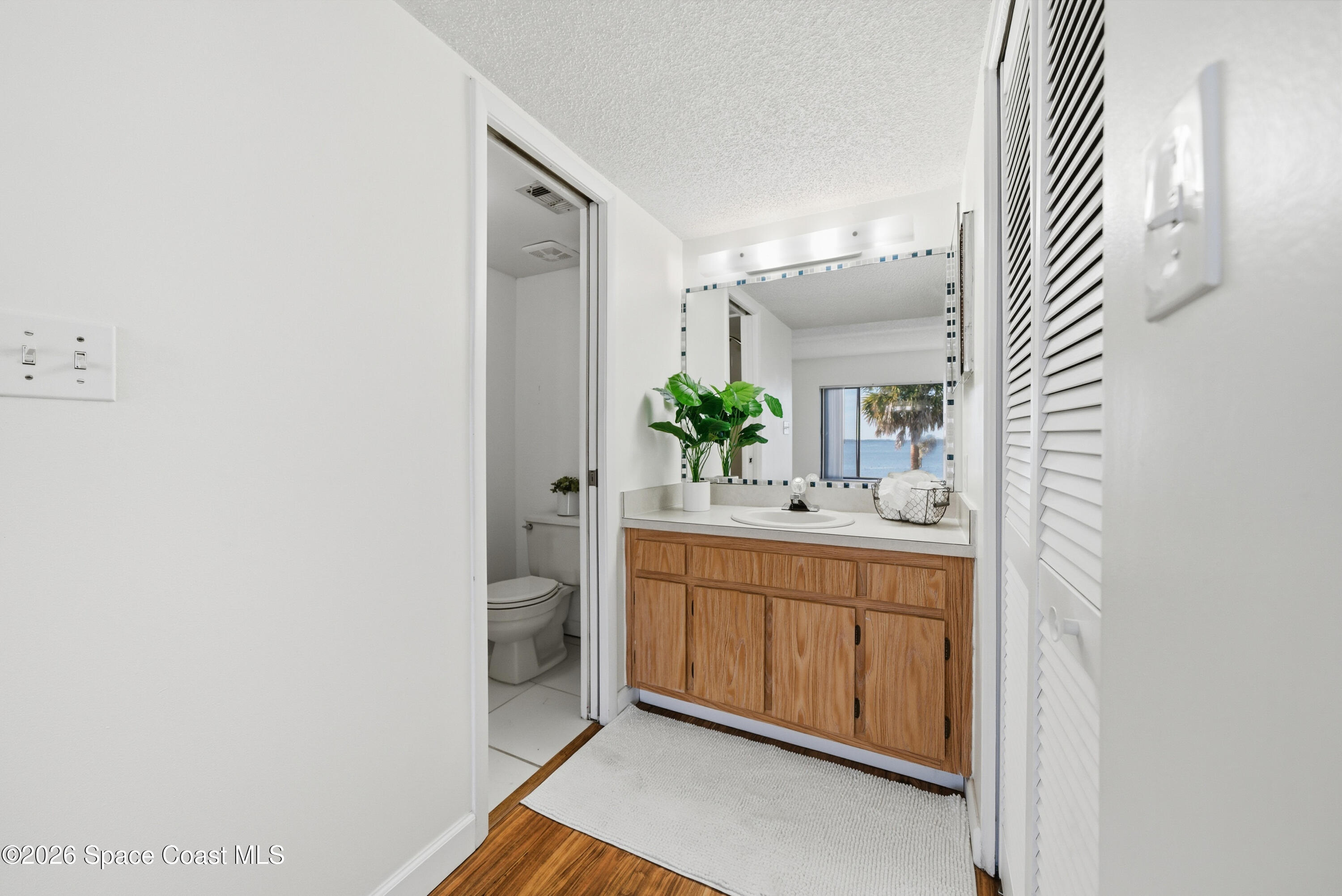 6850 Highway 1, Unit 5204 Grant, FL 32949 - Photo 17 of 33 a spacious bathroom with a granite countertop sink and a mirror