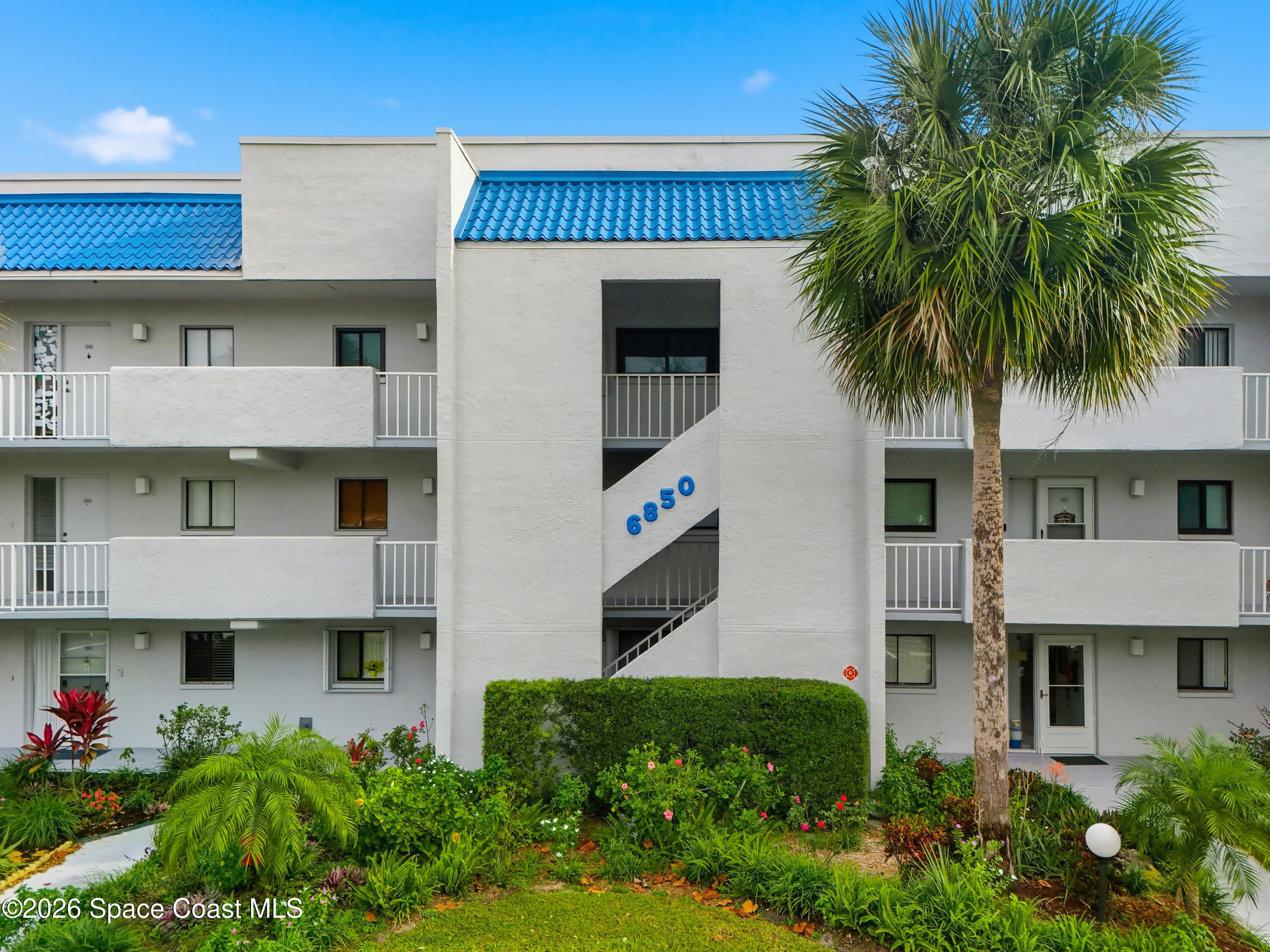6850 Highway 1, Unit 5204 Grant, FL 32949 - Photo 2 of 33 a front view of a house with plants