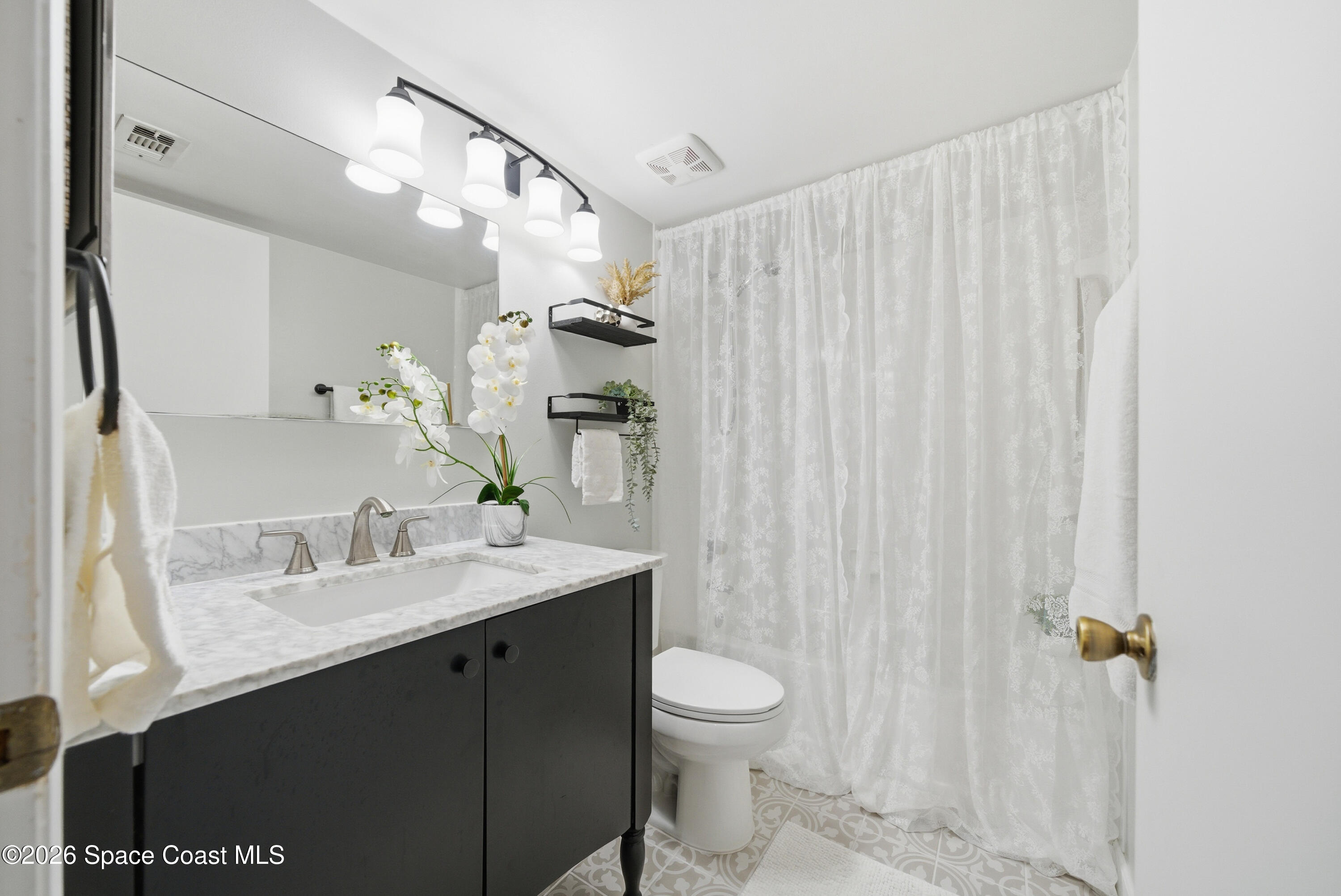 6850 Highway 1, Unit 5204 Grant, FL 32949 - Photo 22 of 33 a bathroom with a sink a toilet and shower