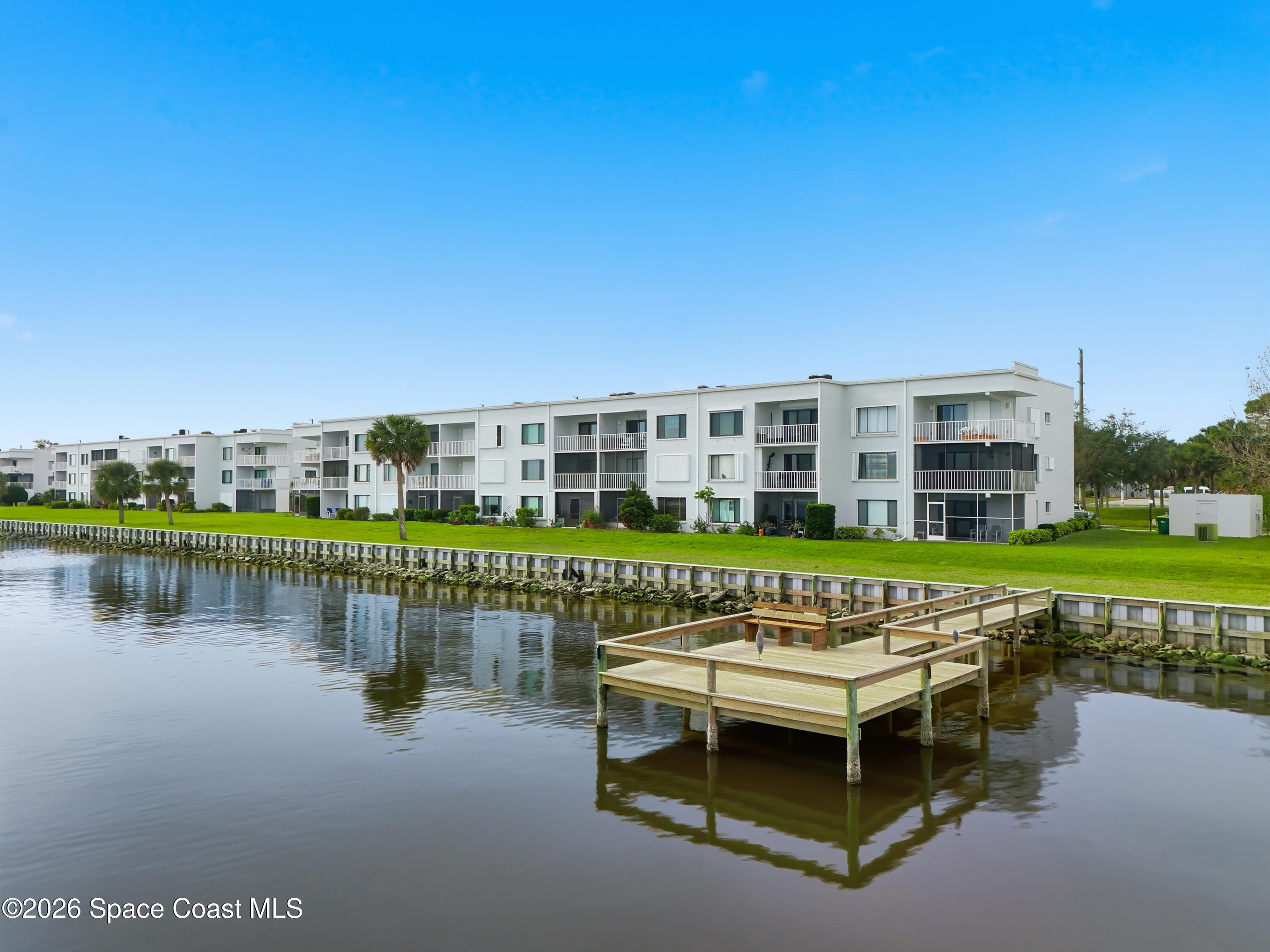 6850 Highway 1, Unit 5204 Grant, FL 32949 - Photo 27 of 33 a view of a lake with a building in front of lake