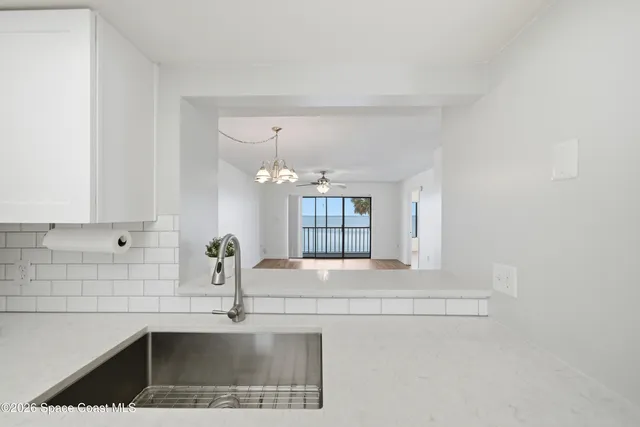 a kitchen with a sink and a window
