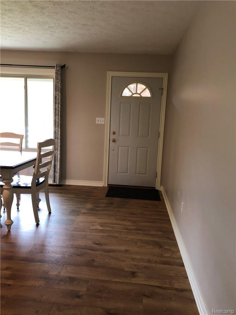9579 Oak Grove Road Howell, MI 48855 - Photo 13 of 33 front door.jpeg