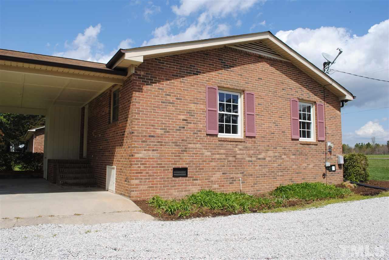 754 Abbott Road Henderson, NC 27537 - Photo 2 of 12 a front view of a house with a yard
