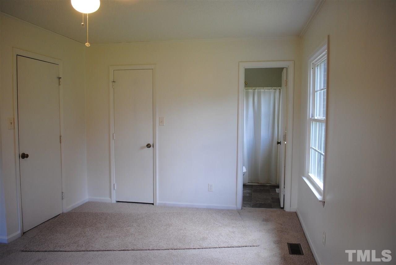 754 Abbott Road Henderson, NC 27537 - Photo 12 of 12 a view of an empty room with window and closet area