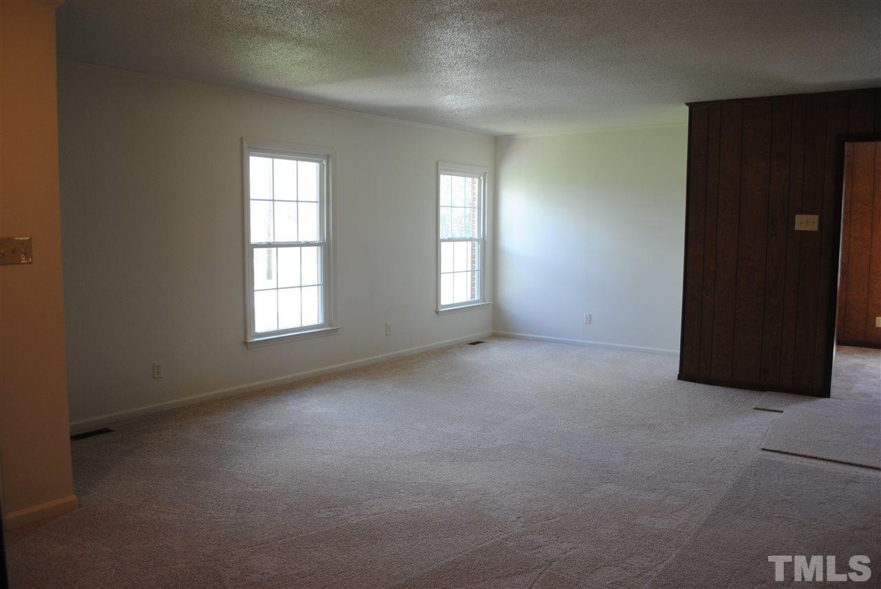 754 Abbott Road Henderson, NC 27537 - Photo 5 of 12 an empty room with windows