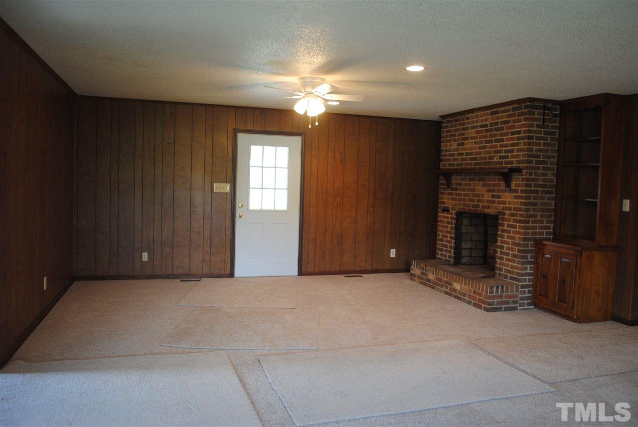 754 Abbott Road Henderson, NC 27537 - Photo 6 of 12 a view of a livingroom with a fireplace