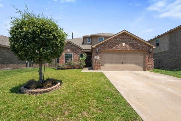 1327 Diamond Drape Drive Rosharon, TX 77583 - Photo 1 of 26 a front view of a house with a yard and garage