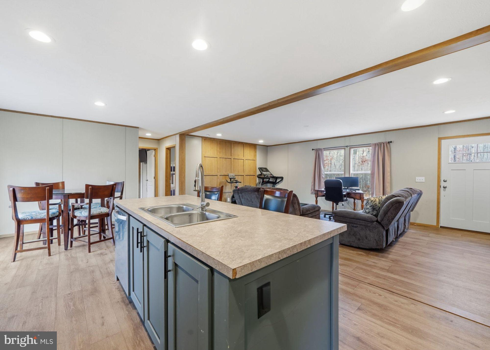 15075 Madison Run Road Gordonsville, VA 22942 - Photo 12 of 23 a living room with furniture a dining table and chairs